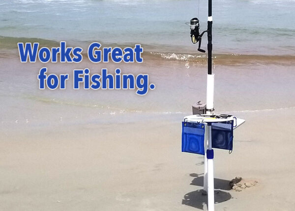 A beach with a fishing pole and a fish finder on it.