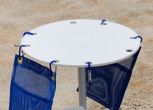 A table with two bags attached to it.