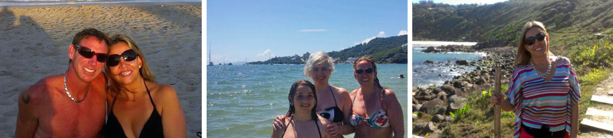 Three women in bikinis standing on the beach.